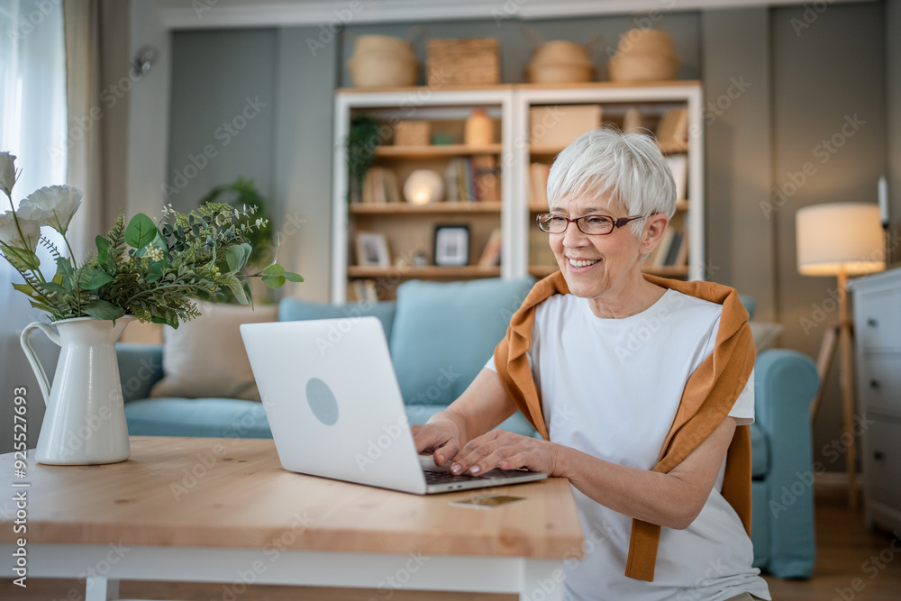 Senior caucasian woman use laptop computer at home for work Senior caucasian woman use laptop computer at home for work