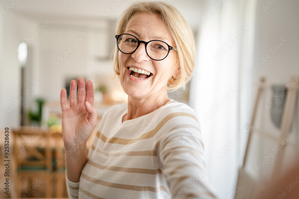 Portrait of one mature blonde caucasian woman with eyeglasses at home Portrait of one mature blonde caucasian woman with eyeglasses at home