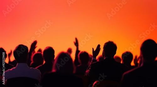 diverse audience applauding corporate seminar setting energetic speaker silhouette