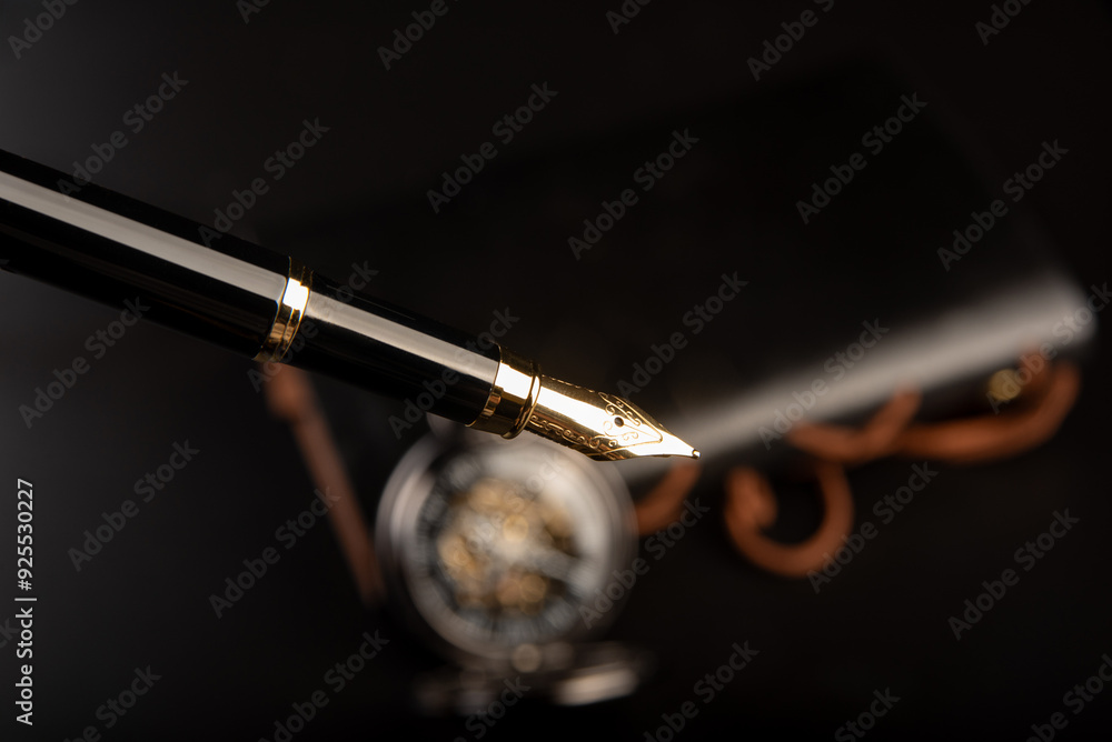 Naklejka premium Fountain pen, beautiful fountain pen and beautiful vintage watch positioned on leather surface, selective focus.