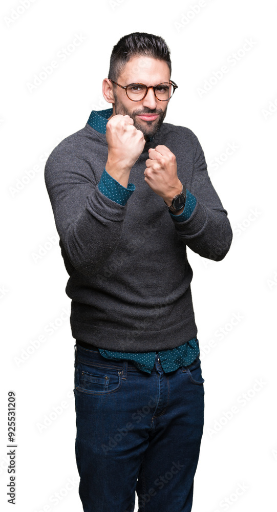 Fototapeta premium Young handsome man wearing glasses over isolated background Ready to fight with fist defense gesture, angry and upset face, afraid of problem