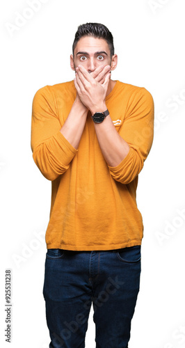 Young handsome man over isolated background shocked covering mouth with hands for mistake. Secret concept.