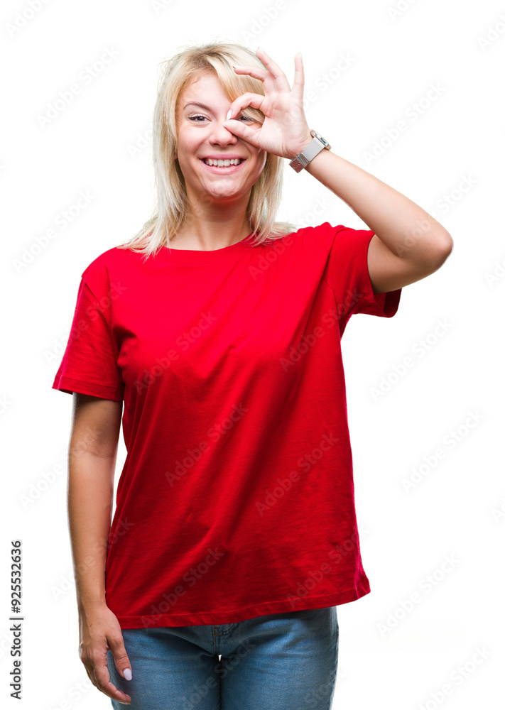 Young beautiful blonde woman wearing red t-shirt over isolated background doing ok gesture with hand smiling, eye looking through fingers with happy face. Young beautiful blonde woman wearing red t-shirt over isolated background doing ok gesture with hand smiling, eye looking through fingers with happy face.