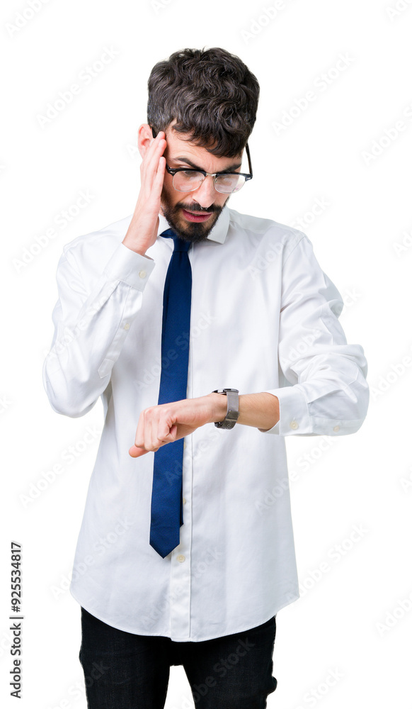 Young handsome business man wearing glasses over isolated background Looking at the watch time worried, afraid of getting late Young handsome business man wearing glasses over isolated background Looking at the watch time worried, afraid of getting late