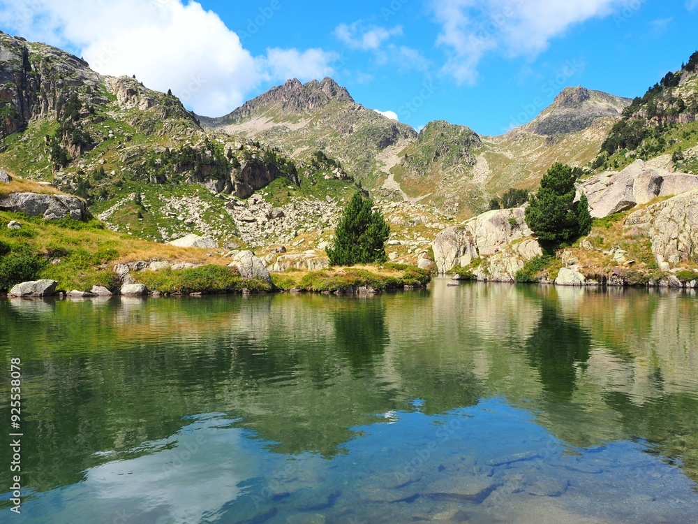 Stunning alpine lake nestled in the mountains: Llac del Circ de Colomers, also known as Lake of the Colomers Cirque, located in the Pyrenees near Salardú, Val d'Aran, Lleida, Catalonia Stunning alpine lake nestled in the mountains: Llac del Circ de Colomers, also known as Lake of the Colomers Cirque, located in the Pyrenees near Salardú, Val d'Aran, Lleida, Catalonia