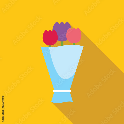 Simple yet elegant bouquet of tulips is standing in a vase, ready to brighten someone's day