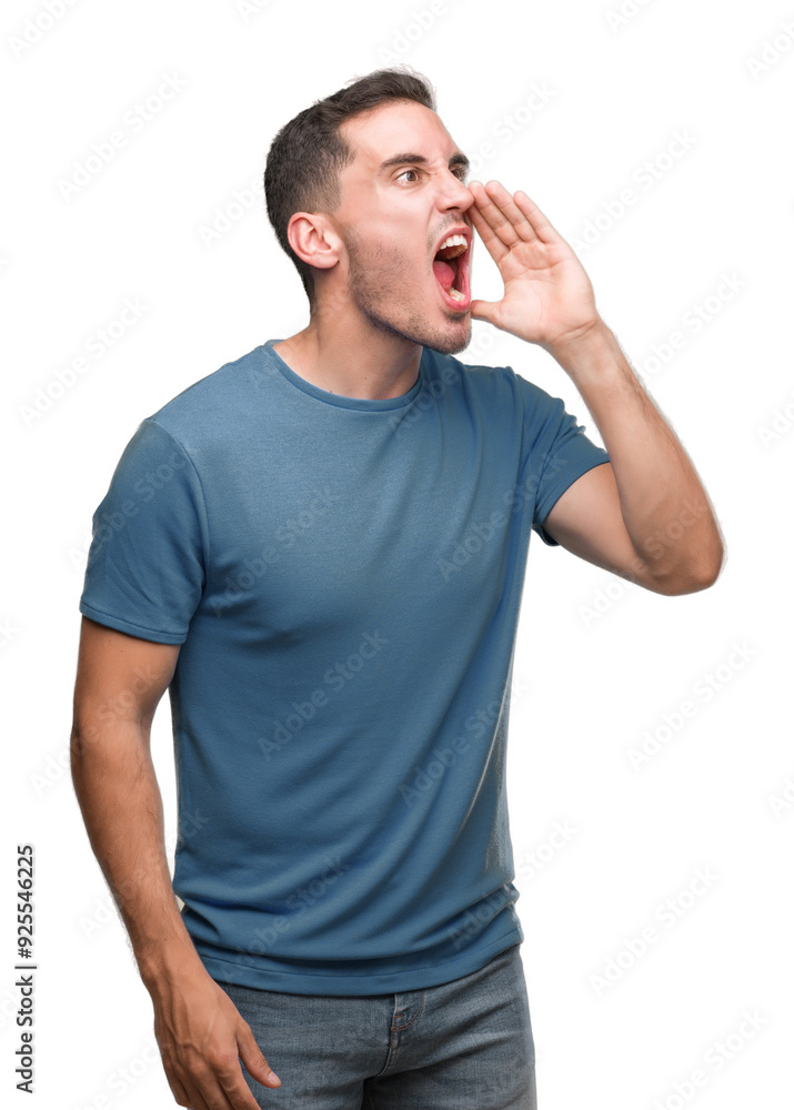 Handsome young casual man shouting and screaming loud to side with hand on mouth. Communication concept. Handsome young casual man shouting and screaming loud to side with hand on mouth. Communication concept.