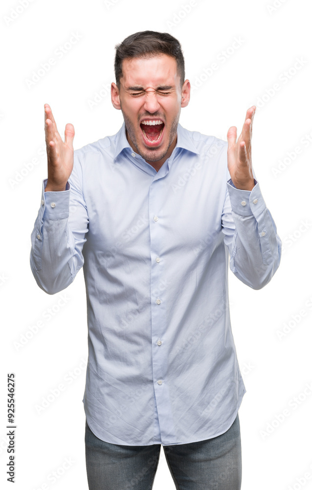 Handsome young businessman celebrating mad and crazy for success with arms raised and closed eyes screaming excited. Winner concept Handsome young businessman celebrating mad and crazy for success with arms raised and closed eyes screaming excited. Winner concept