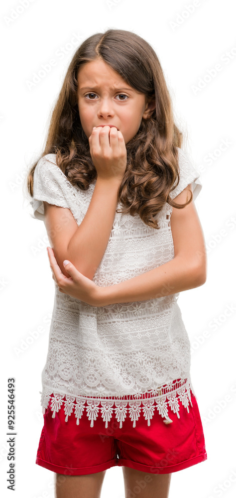 Brunette hispanic girl looking stressed and nervous with hands on mouth biting nails. Anxiety problem. Brunette hispanic girl looking stressed and nervous with hands on mouth biting nails. Anxiety problem.