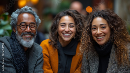 A diverse group of office workers, with a mix of genders and ethnicities, laughing and sharing stories during a casual team-building session.