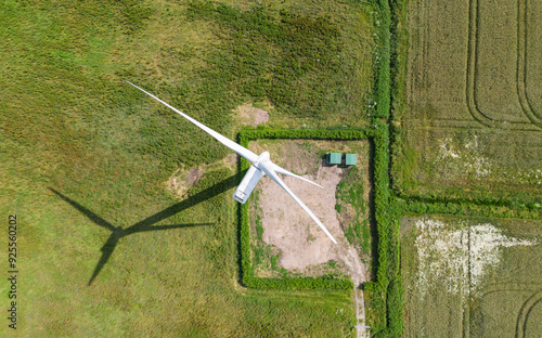 top down birds eye aerial view of a wind turbine in a small rural wind farm in the English countryside