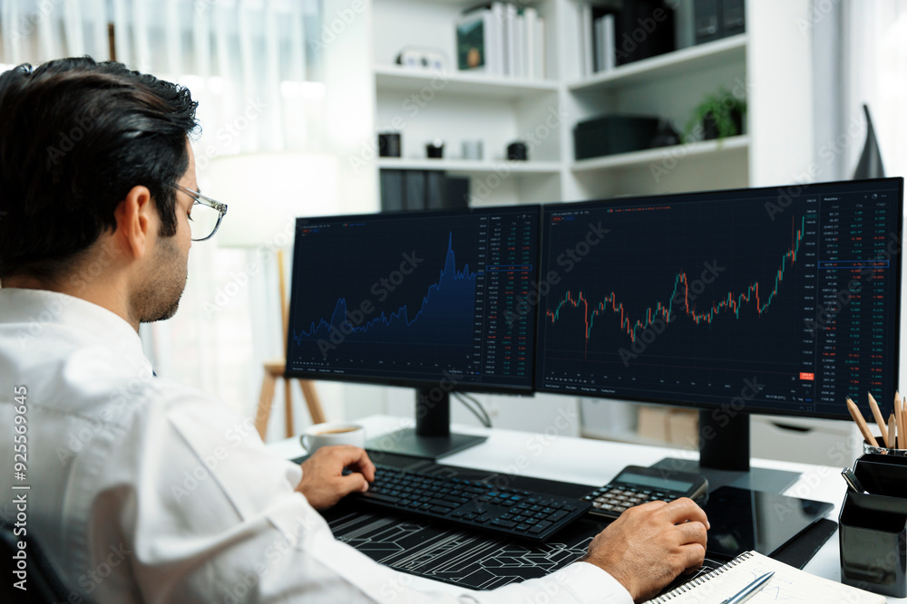 Smart trader businessman analyzing in two dynamic stock exchange investment screen on pc with investing highest profitable financial technology in searching market at modern home office. Surmise. Smart trader businessman analyzing in two dynamic stock exchange investment screen on pc with investing highest profitable financial technology in searching market at modern home office. Surmise.
