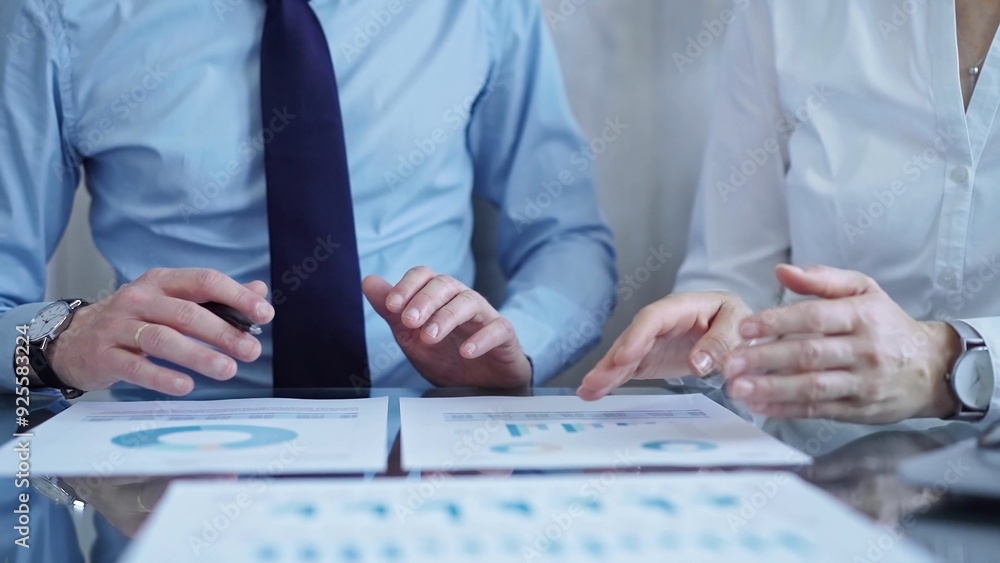 Business people are reviewing a financial results and discussing the terms of the agreement. Teamwork and planning Business people are reviewing a financial results and discussing the terms of the agreement. Teamwork and planning