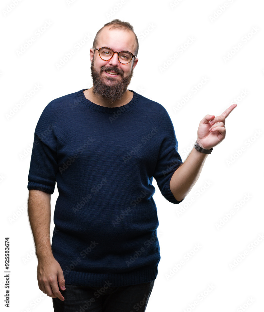 Fototapeta premium Young caucasian hipster man wearing sunglasses over isolated background with a big smile on face, pointing with hand and finger to the side looking at the camera.