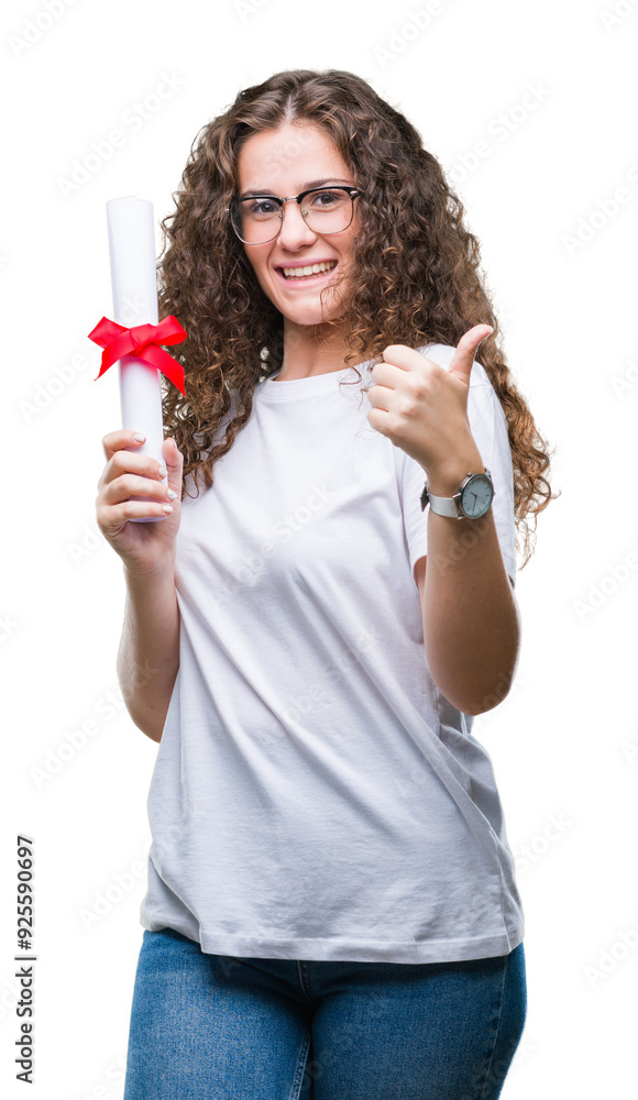 Young brunette girl holding degree and wearing glasses over isolated background happy with big smile doing ok sign, thumb up with fingers, excellent sign Young brunette girl holding degree and wearing glasses over isolated background happy with big smile doing ok sign, thumb up with fingers, excellent sign