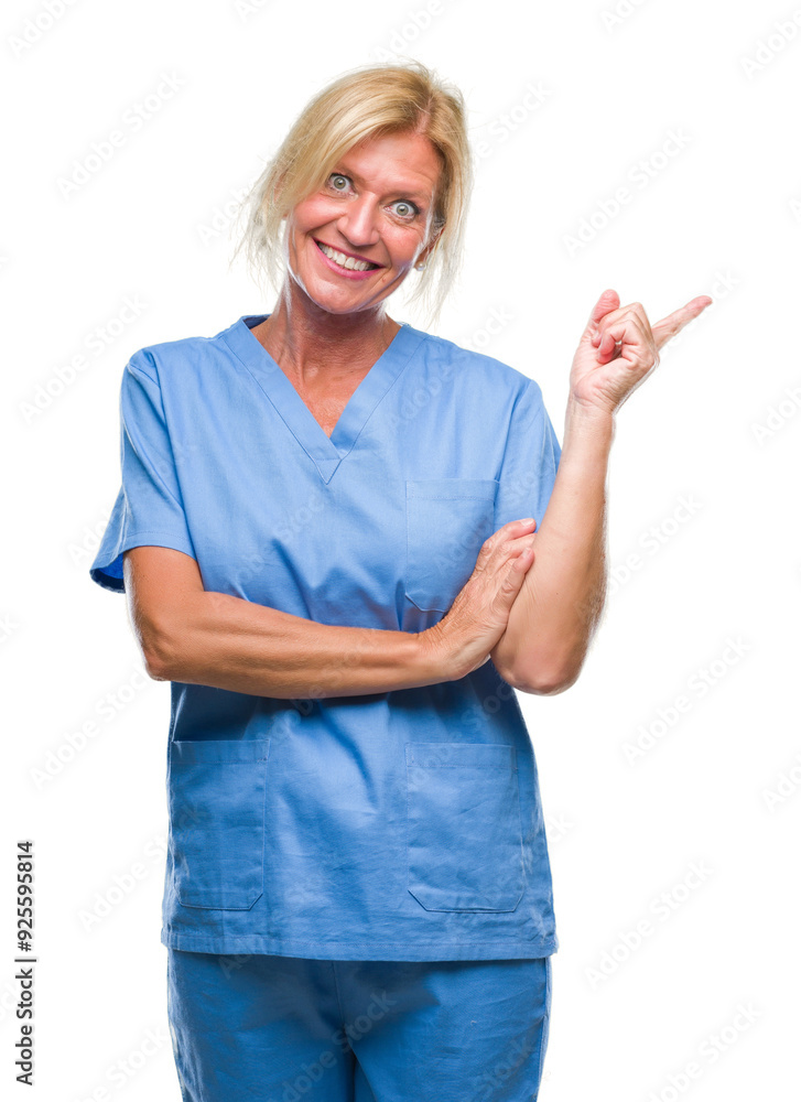 Middle age blonde woman wearing doctor nurse uniform over isolated background with a big smile on face, pointing with hand and finger to the side looking at the camera. Middle age blonde woman wearing doctor nurse uniform over isolated background with a big smile on face, pointing with hand and finger to the side looking at the camera.