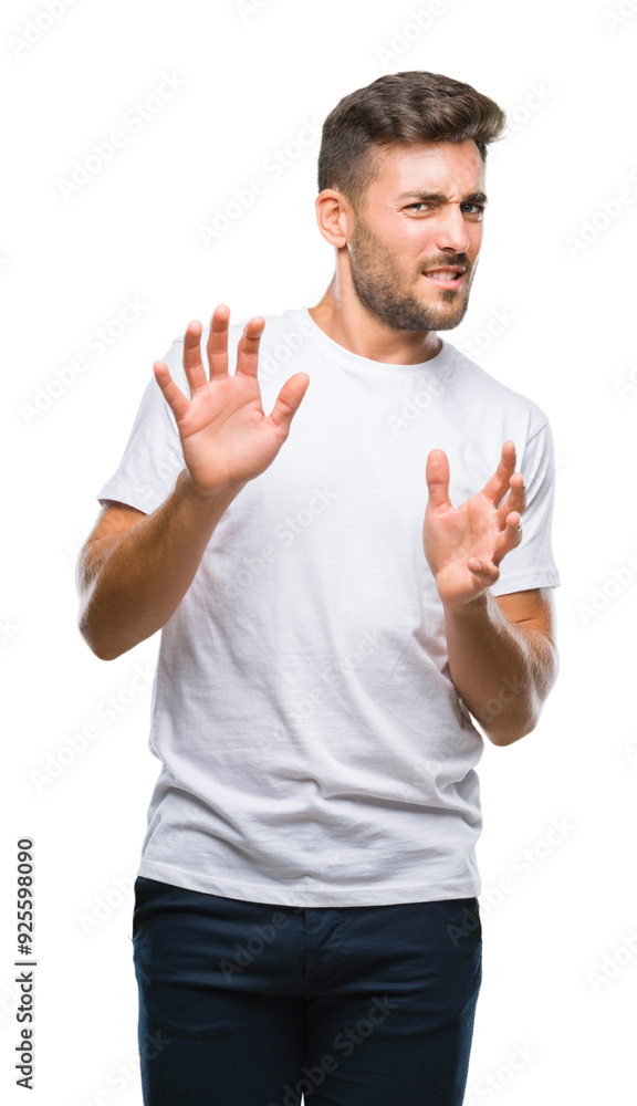Young handsome man over isolated background disgusted expression, displeased and fearful doing disgust face because aversion reaction. With hands raised. Annoying concept. Young handsome man over isolated background disgusted expression, displeased and fearful doing disgust face because aversion reaction. With hands raised. Annoying concept.