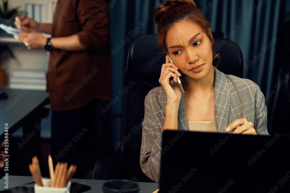 © InfiniteFlow - Businesswoman calling with customers to make new project job at modern office while coworker checking paperwork folder of business plan to database report meeting at over late night time. Infobahn. © InfiniteFlow - Businesswoman calling with customers to make new project job at modern office while coworker checking paperwork folder of business plan to database report meeting at over late night time. Infobahn.