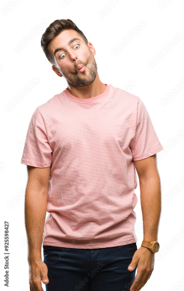 Young handsome man over isolated background making fish face with lips, crazy and comical gesture. Funny expression. Young handsome man over isolated background making fish face with lips, crazy and comical gesture. Funny expression.