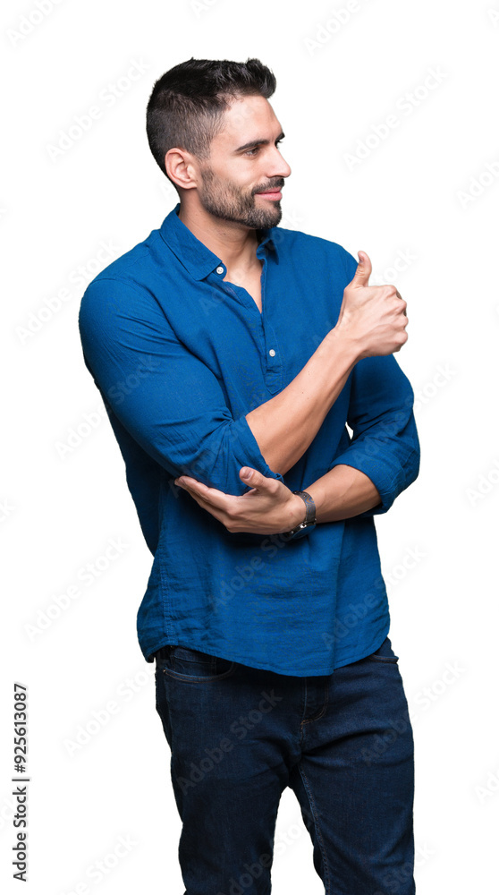 Young handsome man over isolated background Looking proud, smiling doing thumbs up gesture to the side Young handsome man over isolated background Looking proud, smiling doing thumbs up gesture to the side