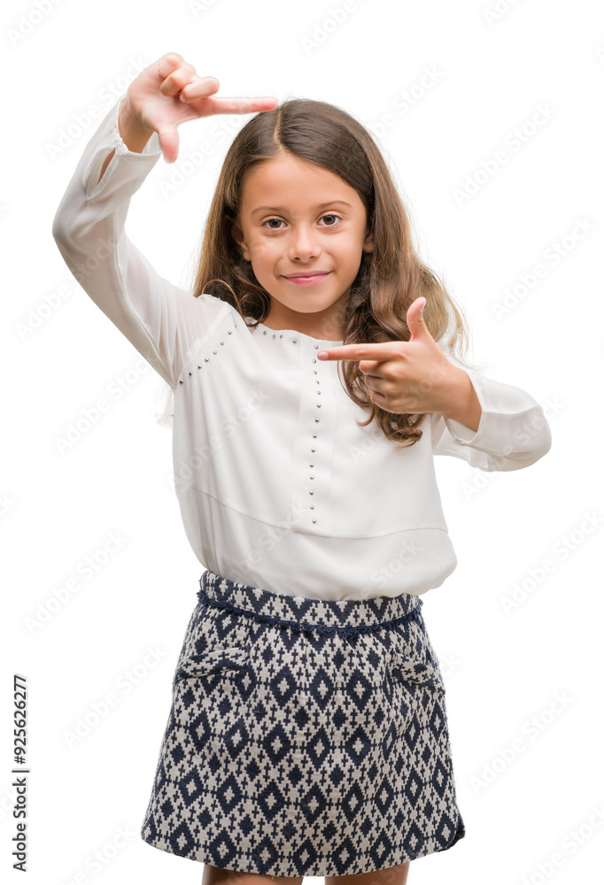 Brunette hispanic girl smiling making frame with hands and fingers with happy face. Creativity and photography concept. Brunette hispanic girl smiling making frame with hands and fingers with happy face. Creativity and photography concept.