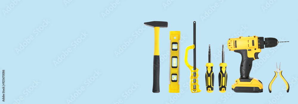Set of different construction tools on light blue background, space for text. Banner design Set of different construction tools on light blue background, space for text. Banner design