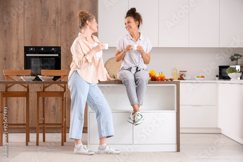Young women having cup of t...
