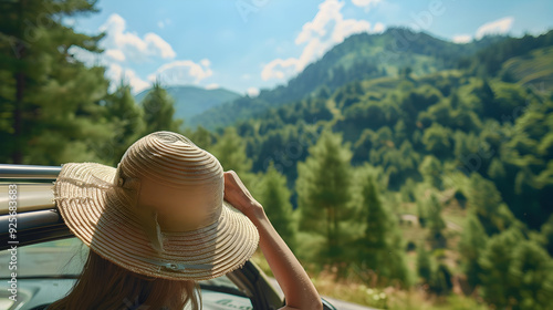 Wallpaper Mural Happy woman hand holding hat outside open window car with green forest woods mountain background. People relaxing as traveler on road trip in holiday vacation. Transportation and trave Torontodigital.ca