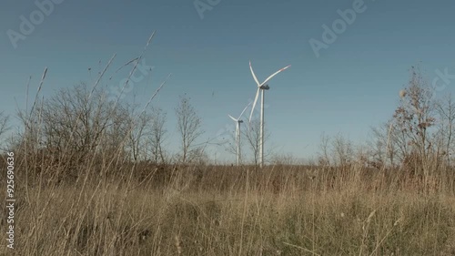 Turkey - November 10 2023: Close-up view of a wind turbine against a clear sky, capturing the details of renewable energy technology in action.