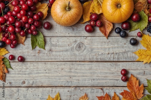 A rustic wooden table adorned with fresh autumn fruits and colorful leaves, symbolizing the harvest season. photo