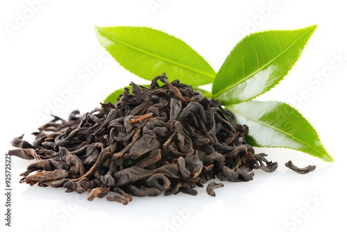 Dry black tea with green tea leaves isolated on white background.