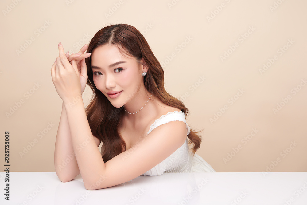 Beautiful young asian woman with clean fresh skin on beige background, Face care, Facial treatment, Cosmetology, beauty and spa, Asian women portrait. Beautiful young asian woman with clean fresh skin on beige background, Face care, Facial treatment, Cosmetology, beauty and spa, Asian women portrait.