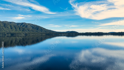 Aerial footage of the alpine lake surrounded by the Southern Alps mountain range