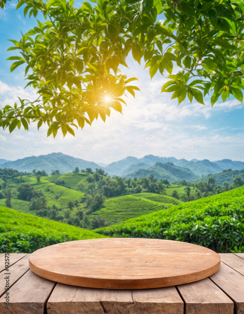 Circle wooden table top with blurred tea plantation landscape against blue sky and blurred green leaf frame Product display concept natural backgroud Circle wooden table top with blurred tea plantation landscape against blue sky and blurred green leaf frame Product display concept natural backgroud