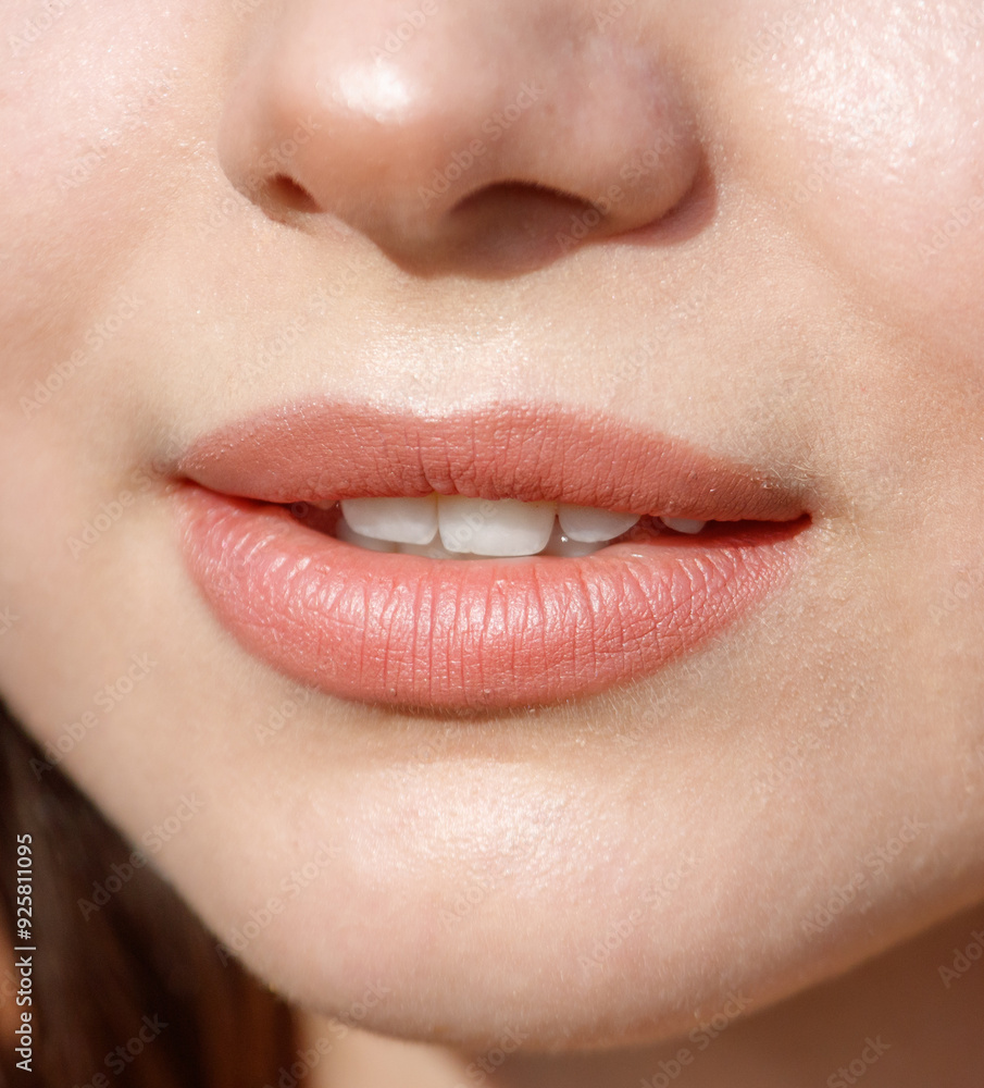 Naklejka premium Close-up of lips on a girl's face. Macro