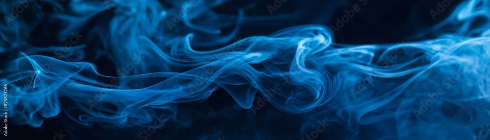Abstract blue smoke on a dark background, creating a mesmerizing and ethereal visual effect. Perfect for backgrounds, overlays, and designs. Abstract blue smoke on a dark background, creating a mesmerizing and ethereal visual effect. Perfect for backgrounds, overlays, and designs.