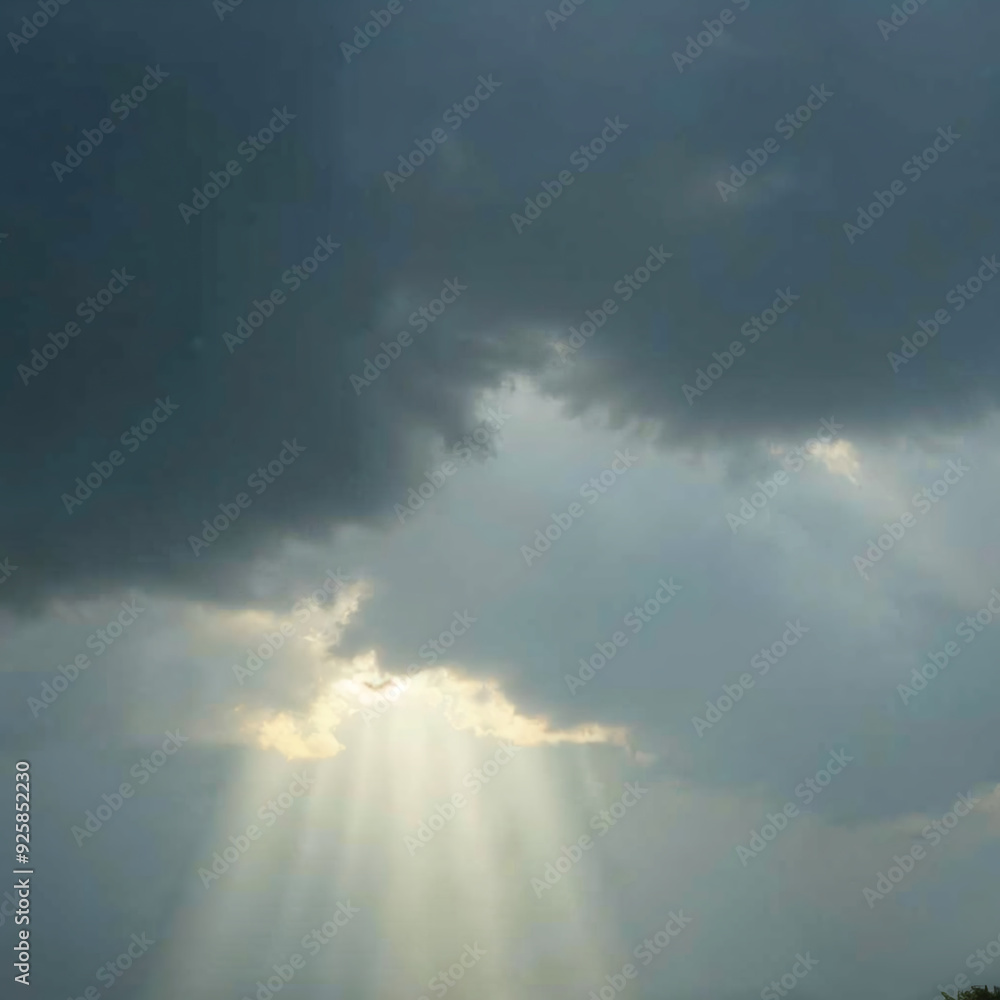 Sunlight Breaking Through Dark Clouds in Dramatic Sky Sunlight Breaking Through Dark Clouds in Dramatic Sky