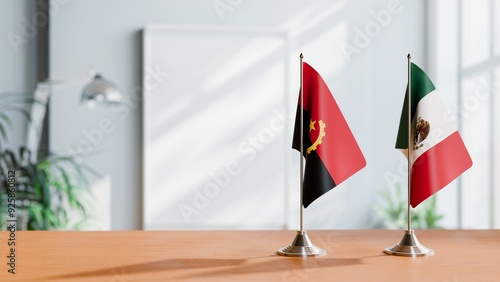 FLAGS OF ANGOLA AND MEXICO  ON TABLE photo