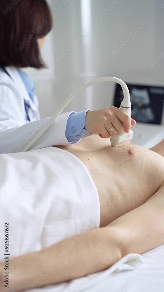 Female doctor using ultrasound machine examining patient abdomen and heart Female doctor using ultrasound machine examining patient abdomen and heart