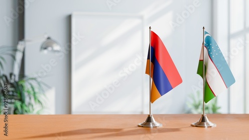 FLAGS OF ARMENIA AND UZBEKISTAN ON TABLE