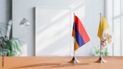 FLAGS OF ARMENIA AND VATICAN ON TABLE