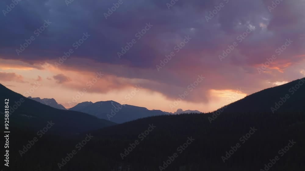 Dramatic sunrise time lapse and cloudy sky over mountains in Banff National Park Dramatic sunrise time lapse and cloudy sky over mountains in Banff National Park