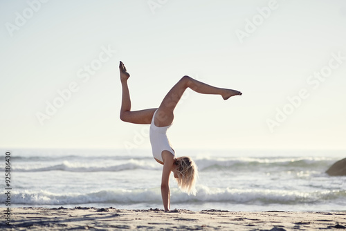 Bild auf Leinwand Travel, summer and girl with handstand on beach on vacation, energy and gymnastic skills with ocean waves