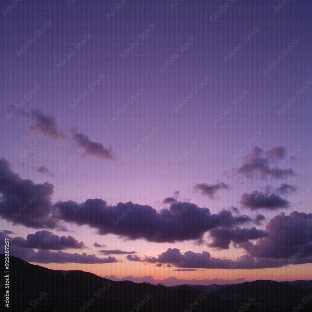 Serene twilight sky with scattered clouds over silhouette hills Serene twilight sky with scattered clouds over silhouette hills