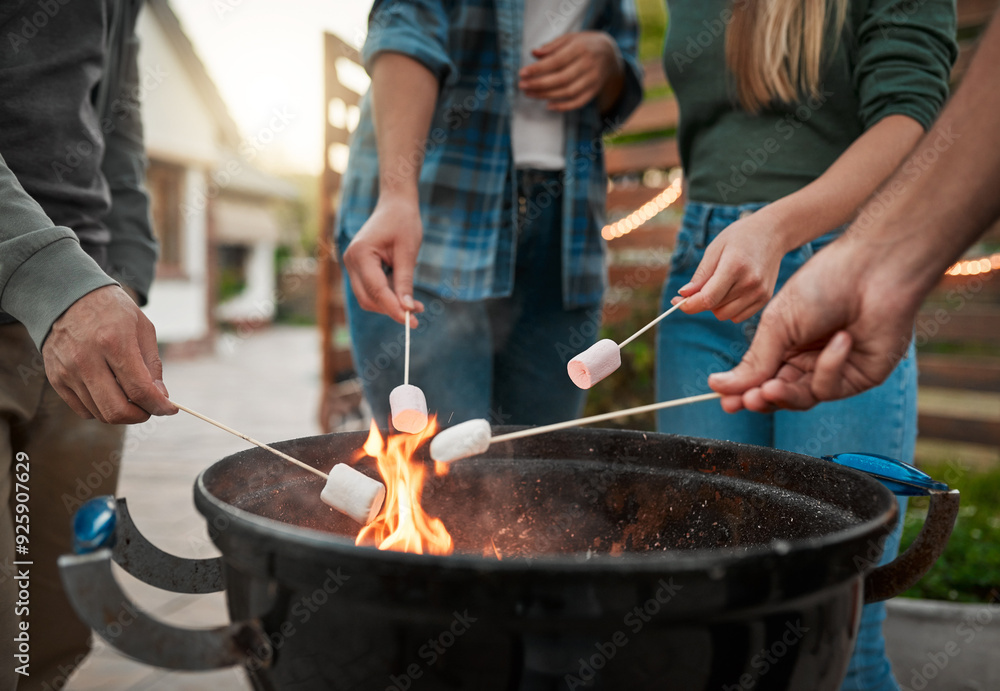 Flame, hands and people roasting marshmallows in backyard for social event, gathering or hang out. Grill, fire and group of friends toasting, burning or melting sweet treat for smores snack outdoor. Flame, hands and people roasting marshmallows in backyard for social event, gathering or hang out. Grill, fire and group of friends toasting, burning or melting sweet treat for smores snack outdoor.