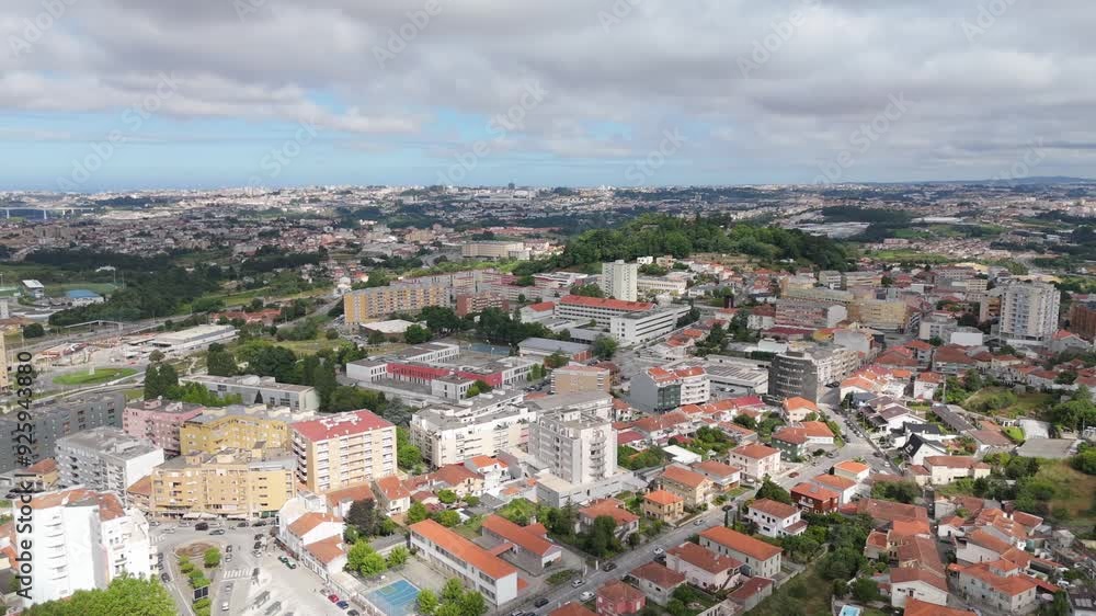 Aerial - Gondomar city center, Portugal, showcasing dense urban buildings and sprawling cityscape. Aerial - Gondomar city center, Portugal, showcasing dense urban buildings and sprawling cityscape.
