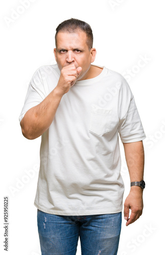 Middle age arab man wearig white t-shirt over isolated background feeling unwell and coughing as symptom for cold or bronchitis. Healthcare concept.