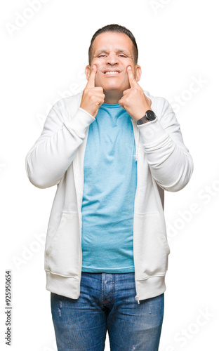 Middle age arab man wearing sweatshirt over isolated background Smiling with open mouth, fingers pointing and forcing cheerful smile