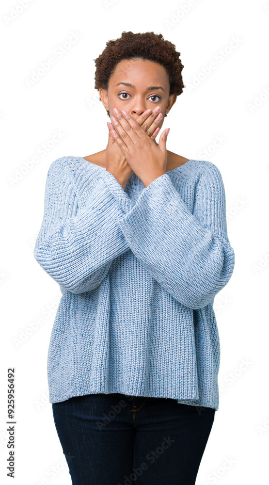 Young beautiful african american woman wearing a sweater over isolated background shocked covering mouth with hands for mistake. Secret concept. Young beautiful african american woman wearing a sweater over isolated background shocked covering mouth with hands for mistake. Secret concept.