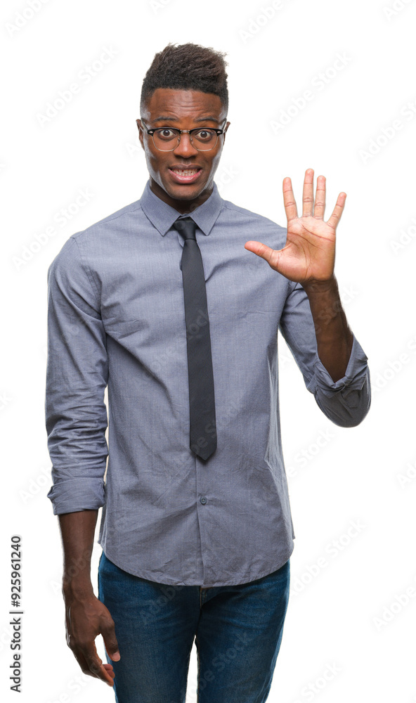 Young african american business man over isolated background showing and pointing up with fingers number five while smiling confident and happy. Young african american business man over isolated background showing and pointing up with fingers number five while smiling confident and happy.